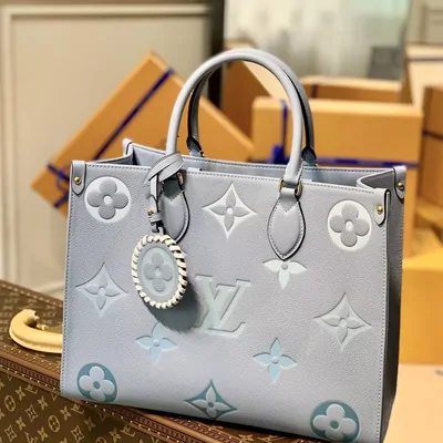Pale grey monogram-embossed tote bag with twin handles