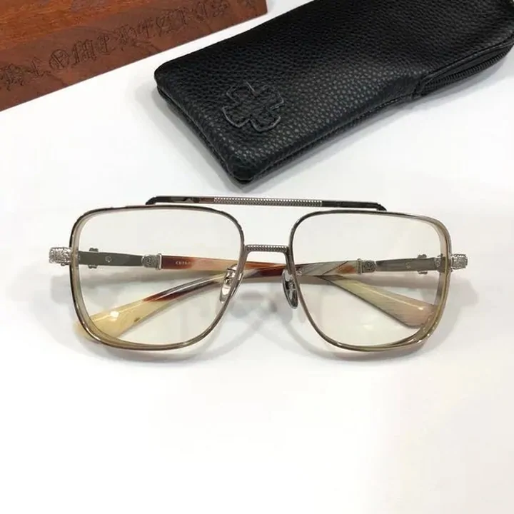 Double-bridge aviator glasses with clear lenses on a black case