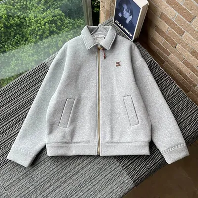 Light grey zip-up blouson jacket photographed flat on a hanger