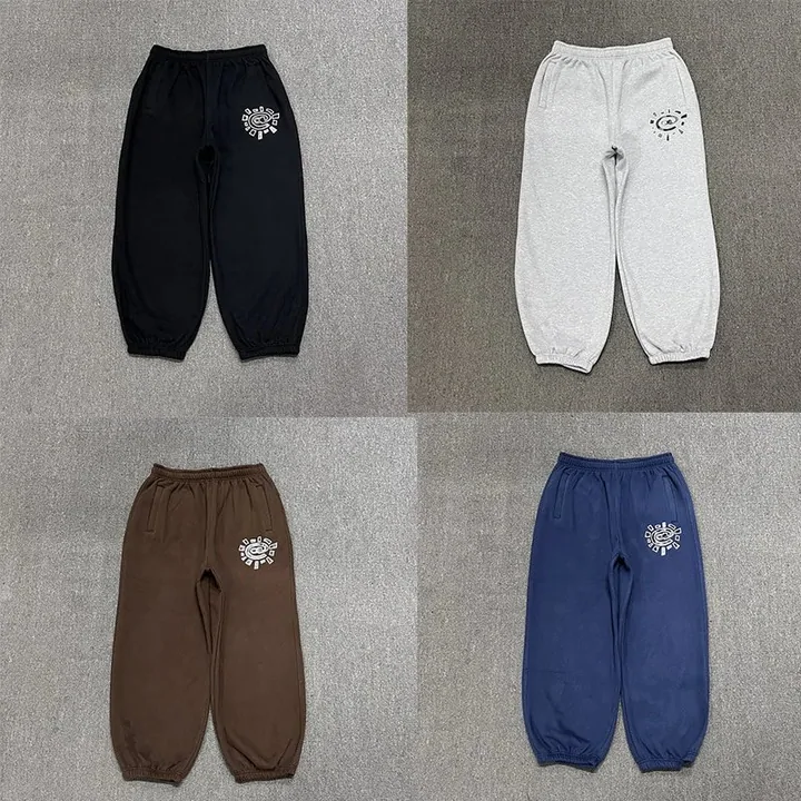Relaxed-fit joggers in navy, cream and brown laid flat